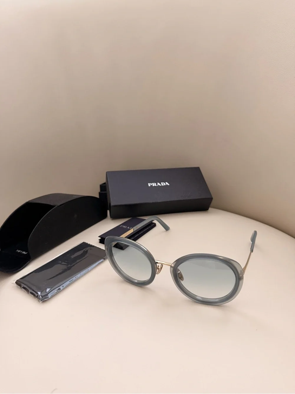 Prada 100% Round Sunglasses in Light Grey with Gold Trim
